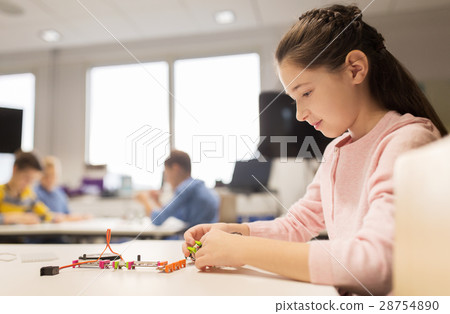 happy girl building robot at robotics school happy girl building robot at robotics school 28754890