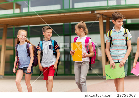 group of happy elementary school students walking 28755068
