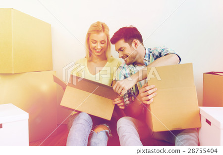 smiling couple with many boxes moving to new home smiling couple with many boxes moving to new home 28755404