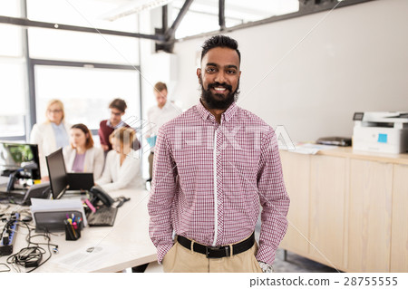 happy indian man over creative team in office happy indian man over creative team in office 28755555