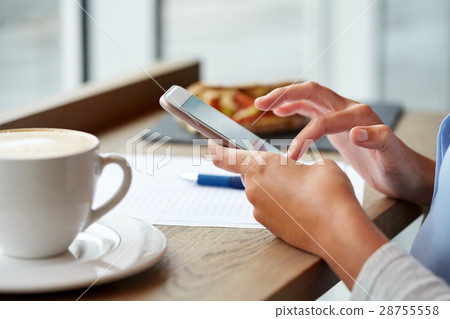 woman with smartphone at cafe woman with smartphone at cafe 28755558
