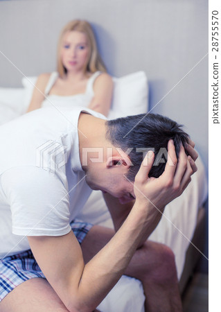 man sitting on the bed with woman on the back man sitting on the bed with woman on the back 28755570