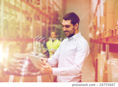 happy businessman with clipboard at warehouse happy businessman with clipboard at warehouse 28755687