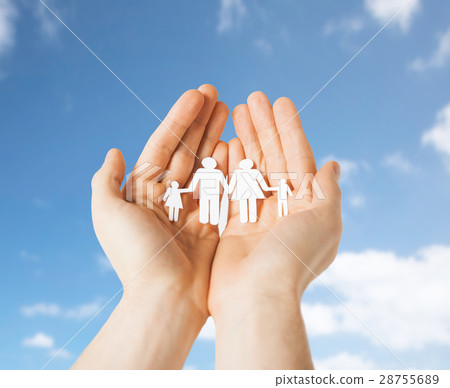 close up of hands holding paper family pictogram close up of hands holding paper family pictogram 28755689