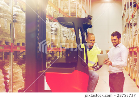 men with tablet pc and forklift at warehouse men with tablet pc and forklift at warehouse 28755737