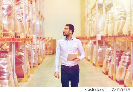 businessman with tablet pc at warehouse 28755739