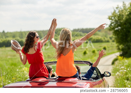 happy friends driving in cabriolet car at country happy friends driving in cabriolet car at country 28756005