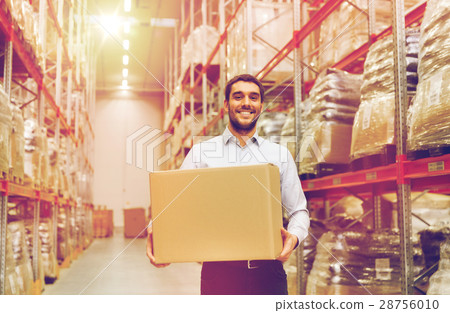 happy man with cardboard parcel box at warehouse 28756010