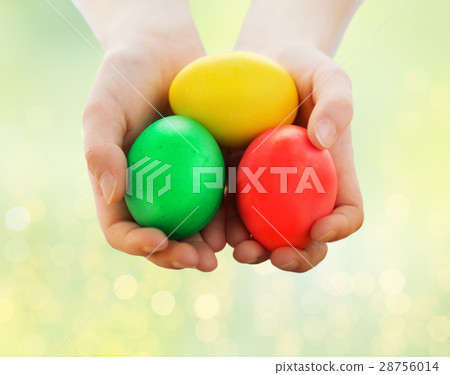 close up of child hands holding easter eggs close up of child hands holding easter eggs 28756014