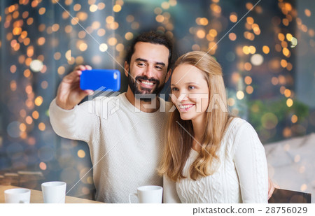 happy couple with tablet pc and coffee at cafe happy couple with tablet pc and coffee at cafe 28756029
