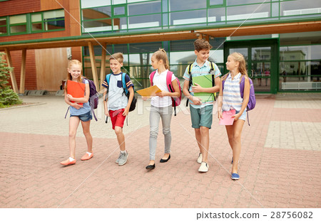 group of happy elementary school students walking 28756082