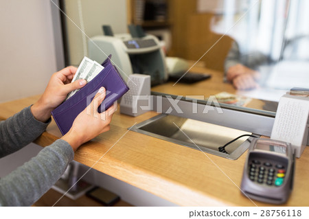 hands with money at bank or currency exchanger hands with money at bank or currency exchanger 28756118