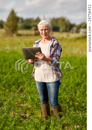 senior woman with tablet pc computer at county 28756451