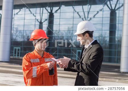 boss giving salary in an envelope. cash in hand 28757056