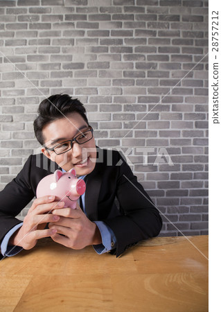 business man take piggy bank 28757212