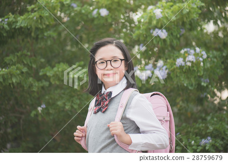 Asian school girl with pink backpack looking up 28759679