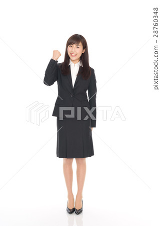 一位穿著西裝的年輕女士 一位穿著西裝的年輕女士 28760348