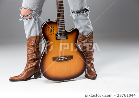 Legs in Jeans and Cowboys Boots Legs in Jeans and Cowboys Boots 28761044