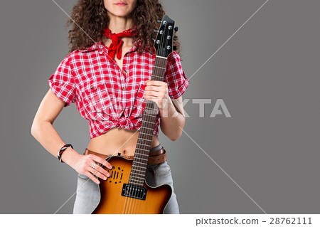 The cowgirl fashion woman over a gray background The cowgirl fashion woman over a gray background 28762111