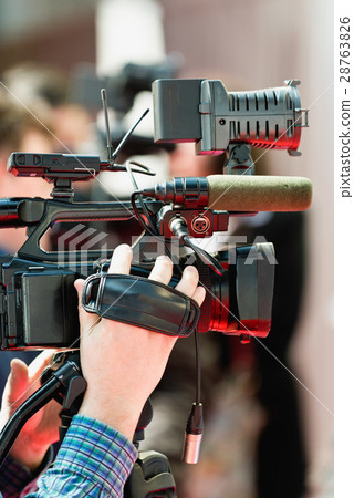 TV cameraman working TV cameraman working 28763826