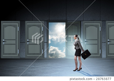 Businesswoman walking towards open door 28763877