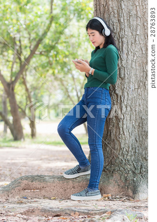 Young beautiful woman girl listening music Young beautiful woman girl listening music 28763893