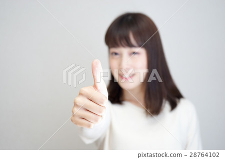 A woman who makes a "good" pose A woman who makes a "good" pose 28764102
