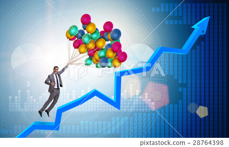 Businessman flying on balloons over graph 28764398