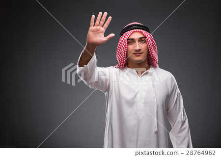 Arab businessman on gray background Arab businessman on gray background 28764962