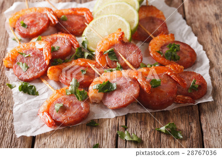Delicious grilled shrimp with chorizo on skewers Delicious grilled shrimp with chorizo on skewers 28767036