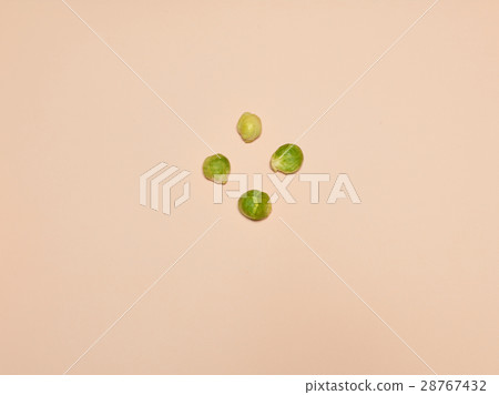 The piles of Brussels sprouts on a pink background The piles of Brussels sprouts on a pink background 28767432