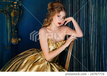 Beautiful woman in a ball gown 28767716