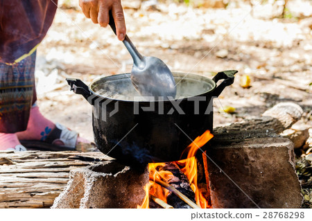 Cooking in the nature. Cauldron on fire in forest 28768298