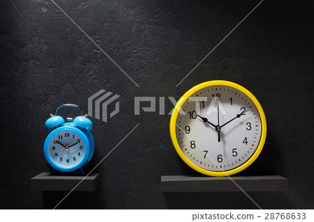 wall and alarm clock at black background wall and alarm clock at black background 28768633