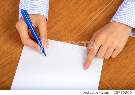 Female hand signing contract. Female hand signing contract. 28775209