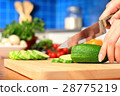 Female chopping food ingredients. 28775219