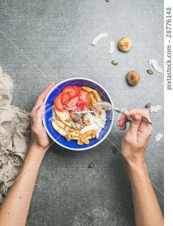 Woman's hands holding drizzlier and blue healthy 28776148