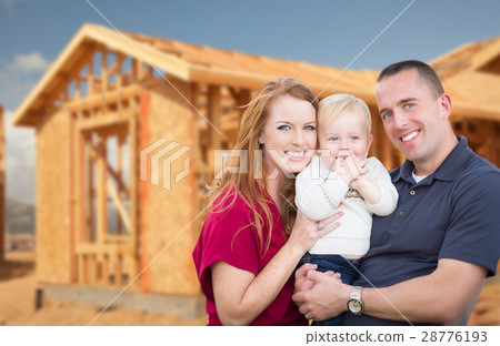 Young Military Family Outside Their New Home Framing Young Military Family Outside Their New Home Framing 28776193