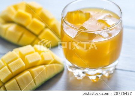 Mango juice on the wooden table Mango juice on the wooden table 28776457