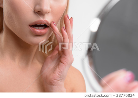 Voluptuous girl caring of her appearance 28776824