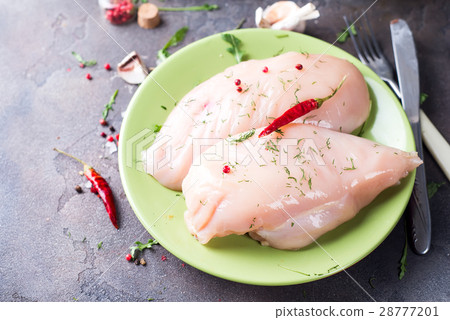 Raw cut chicken fillet 28777201