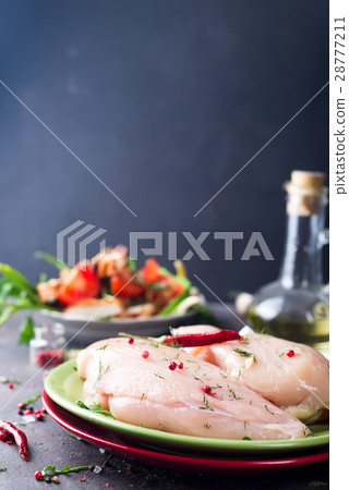 Raw cut chicken fillet 28777211