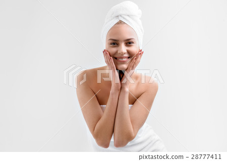 Joyful woman likes her skin after bathing Joyful woman likes her skin after bathing 28777411