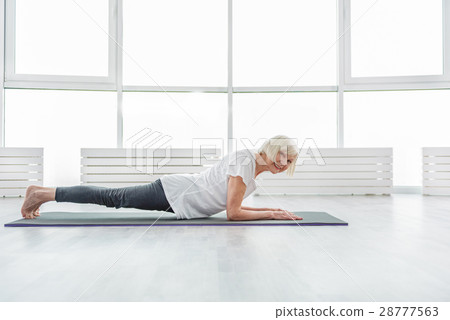 Happy mature lady doing exercise Happy mature lady doing exercise 28777563