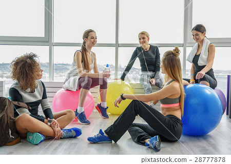 Laughing group of sportive women 28777878