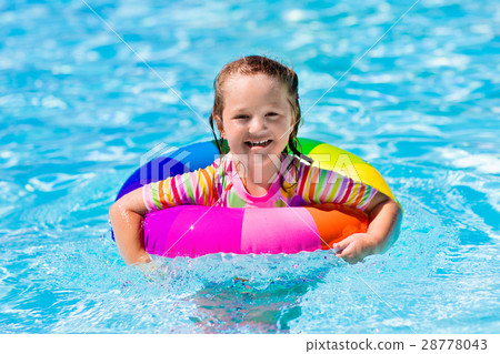 Little girl with toy ring in swimming pool 28778043