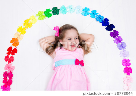 Little girl with colorful bow. Hair accessory 28778044