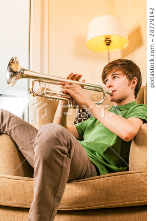 Playing the trumpet in the living room 28779142