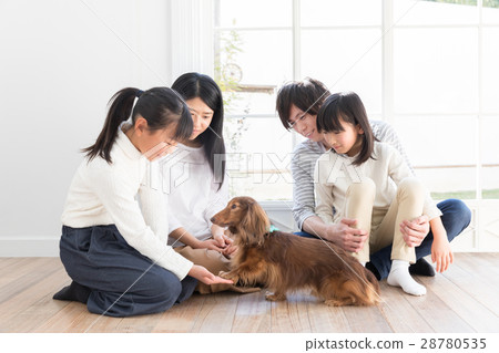 A family relaxing in the living room 28780535