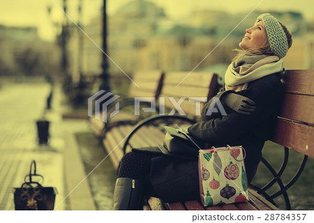 Dreaming woman in winter city a festive mood 28784357